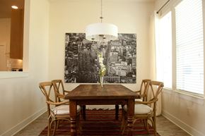 Huntsville apartment for rent - A dining room with a wooden table and chairs.