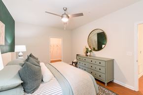 Soddy-Daisy apartment for rent - A bedroom with a bed, dresser, and mirror.