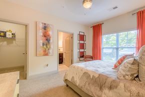 Jamestown apartment for rent - a bedroom with a bed and a door to a bathroom
