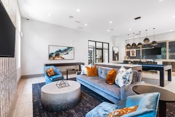 Morrisville apartment for rent - a living room with a blue couch and a table