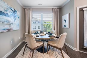 Morrisville apartment for rent - a dining room with a table and chairs and a window