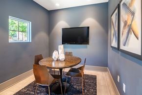 Morrisville apartment for rent - a dining room with a table and chairs and a television