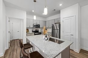 Kernersville apartment for rent - an open kitchen with granite counter top and stainless steel appliances