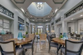 Palm Coast apartment for rent - A dining room with a wooden table and chairs.