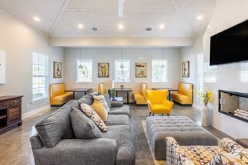 Lake Charles apartment for rent - a living room with couches and chairs and a television