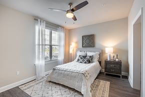 Lake Charles apartment for rent - a bedroom with a bed and a ceiling fan