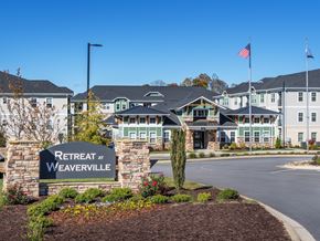 Weaverville apartment for rent - the view of retreat at weaverville with a sign in front of a building