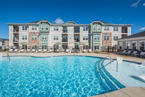 Weaverville apartment for rent - a swimming pool with an apartment building in the background