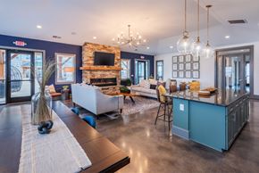 Weaverville apartment for rent - a large living room with a kitchen and a fireplace