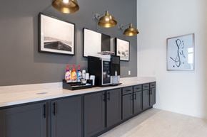 San Antonio apartment for rent - A kitchen with dark cabinets and a white countertop.