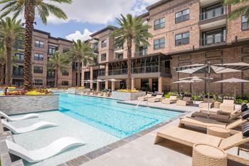 Resort-style pool with cabanas and fire pit
