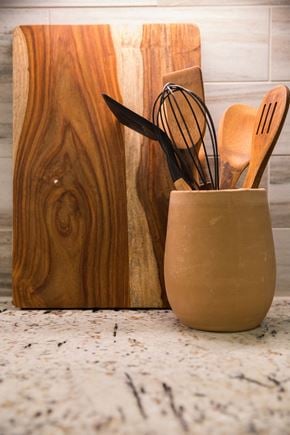 Houston apartment for rent - Wooden utensils are placed in a container on a countertop at 27Seventy Lower Heights apartments in Houston, TX.