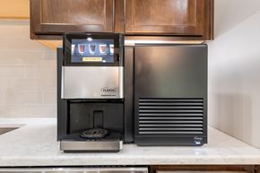 Raleigh apartment for rent - a coffee maker and a refrigerator on a kitchen counter