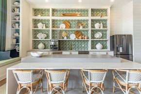 Leland apartment for rent - a kitchen with a large island with four chairs
