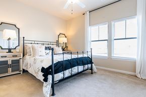 Hampstead apartment for rent - a bedroom with a bed and two windows