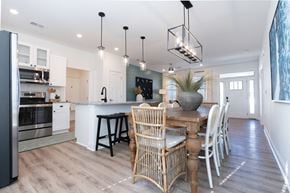 Leland apartment for rent - A modern kitchen with a dining table and chairs.