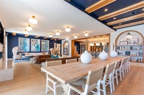 Leland apartment for rent - a dining room with a wooden table and white vases on it