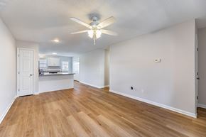 Winterville apartment for rent - A room with a ceiling fan and wooden flooring.