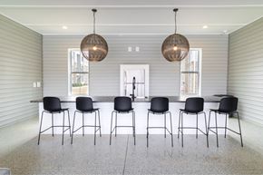 Greenville apartment for rent - a large dining room with a long table and chairs