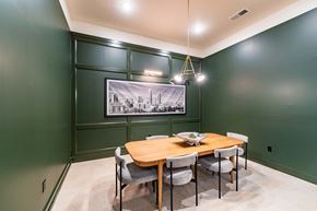 Charlotte townhouse for rent - A dining room with a wooden table and chairs.