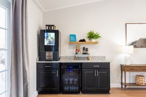 Rural Hall apartment for rent - A black fridge and freezer in a kitchen with a TV on top