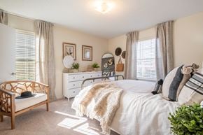 Rural Hall apartment for rent - A bedroom with a bed, dresser, and chair