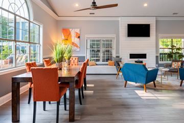 Charlotte apartment for rent - a living and dining room with a table and chairs
