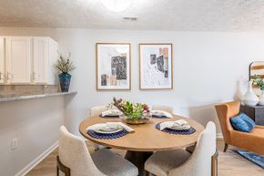 Spring Lake apartment for rent - a dining room with a wooden table and chairs