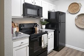 Murfreesboro apartment for rent - our apartments offer a kitchen with black appliances and white cabinets