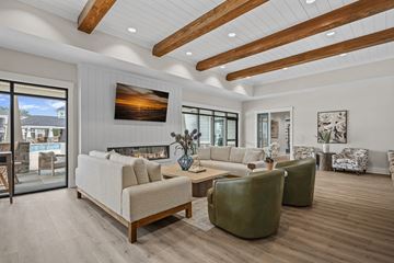 Oxford townhouse for rent - A modern living room with a large painting on the wall and a fireplace.