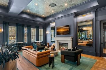 Wellford apartment for rent - A living room with a fireplace and a painting on the wall.