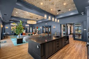 Wellford apartment for rent - A modern kitchen with dark wood cabinets and a large island.