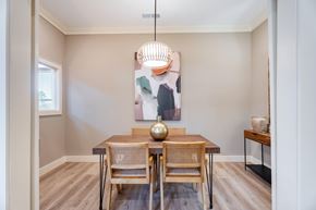 Wake Forest apartment for rent - A dining room with a wooden table and chairs.