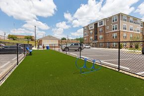 Spartanburg apartment for rent - a fence with olympic rings in front of a building
