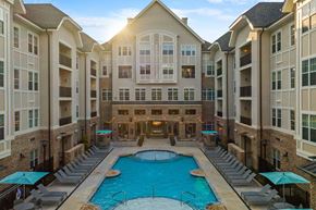 Greensboro apartment for rent - a large swimming pool in the middle of an apartment building