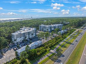 Rosemary Beach apartment for rent - an aerial view of apartment buildings on the side of a road