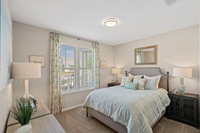 Concord apartment for rent - a bedroom with a large bed and a window