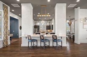 Concord apartment for rent - a large kitchen with a white island and blue chairs