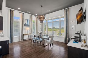 Concord apartment for rent - a dining room with a table and chairs and large windows