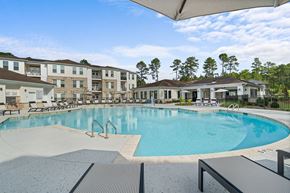 Pinehurst apartment for rent - a large swimming pool with buildings in the background