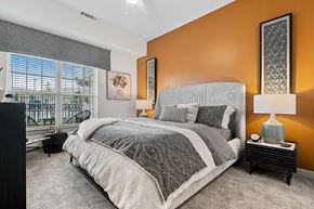 Greensboro apartment for rent - a bedroom with a bed and a window