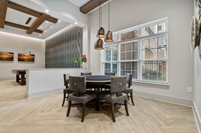 Greensboro apartment for rent - a dining room with a table and chairs and a large window