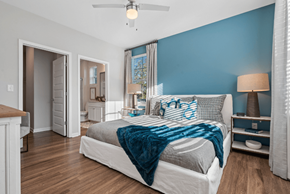 Denver apartment for rent - a bedroom with a large bed and a bathroom