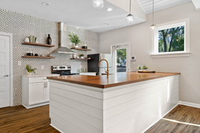 Asheville apartment for rent - a white kitchen with a wooden counter top