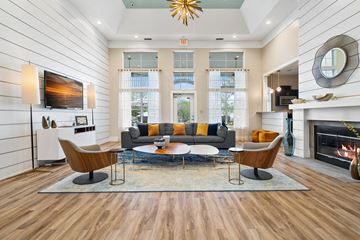 Kernersville apartment for rent - a living room with a couch and a table and a fireplace