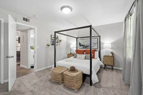 Winston Salem apartment for rent - a bedroom with a large bed and a white closet