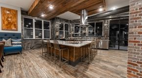 Winston Salem apartment for rent - the kitchen has a large island with a marble counter top and stainless steel appliances
