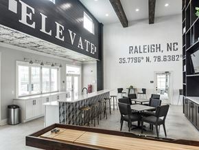 Raleigh apartment for rent - a dining room with a table and chairs in front of a counter