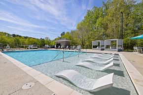 Wake Forest apartment for rent - A pool with a fountain in the middle of it.