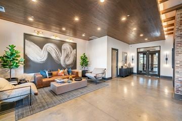 Huntersville apartment for rent - a living room with furniture and a large painting on the wall